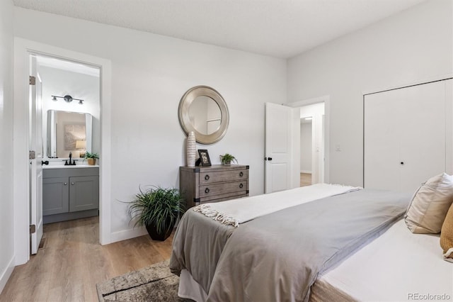 1418 5th St, Fort Lupton, CO 80621 - bedroom with light wood-type flooring and ensuite bath