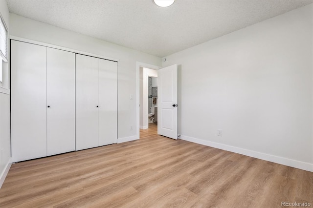 1418 5th St, Fort Lupton, CO 80621 - unfurnished bedroom with light wood-style flooring and a closet
