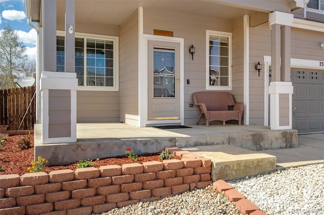 2336 Klein Pl, Colorado Springs, CO 80951 - entrance to property featuring fence, a porch, and a garage