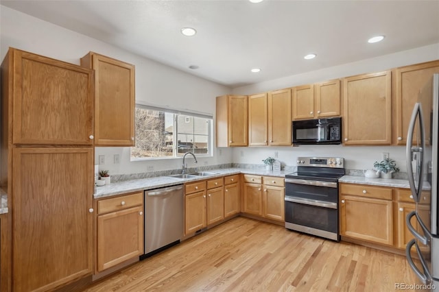 2336 Klein Pl, Colorado Springs, CO 80951 - kitchen featuring light wood-style flooring, a sink, recessed lighting, and appliances with stainless steel finishes