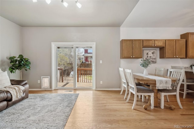 2336 Klein Pl, Colorado Springs, CO 80951 - dining area featuring baseboards and light wood-style floors
