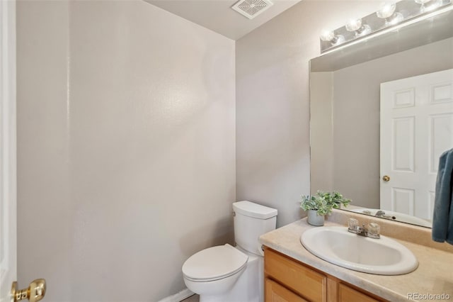 2336 Klein Pl, Colorado Springs, CO 80951 - half bath featuring visible vents, toilet, and vanity