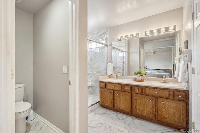 2336 Klein Pl, Colorado Springs, CO 80951 - bathroom featuring marble finish floor, a sink, connected bathroom, and toilet