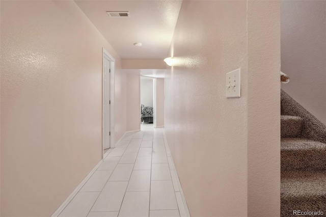 2336 Klein Pl, Colorado Springs, CO 80951 - hall with visible vents, baseboards, stairs, and light tile patterned floors
