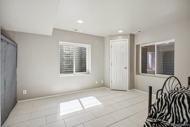 2336 Klein Pl, Colorado Springs, CO 80951 - bedroom featuring baseboards, visible vents, and light tile patterned floors