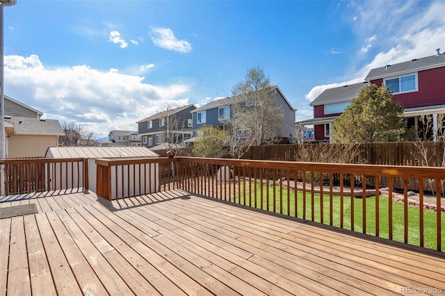 2336 Klein Pl, Colorado Springs, CO 80951 - wooden terrace featuring fence, a lawn, and a residential view