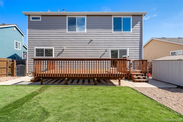 2336 Klein Pl, Colorado Springs, CO 80951 - rear view of property featuring a wooden deck, fence, a yard, and a patio