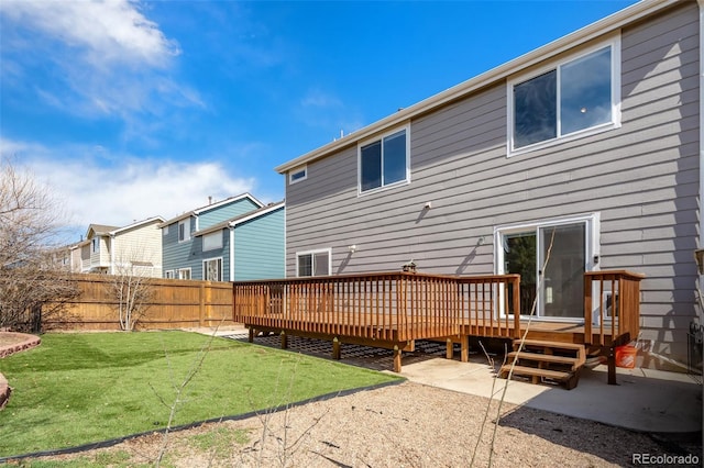 2336 Klein Pl, Colorado Springs, CO 80951 - back of property featuring a wooden deck, a yard, a residential view, and fence