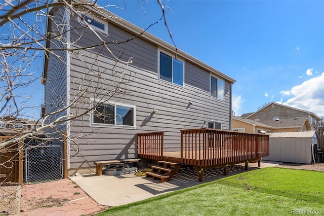 2336 Klein Pl, Colorado Springs, CO 80951 - rear view of house featuring an outbuilding, a deck, a yard, a shed, and a patio