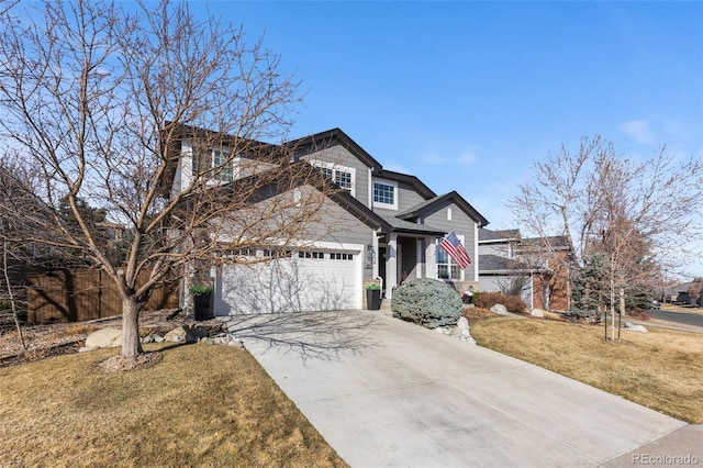 view of front of house with concrete driveway, an attached garage, fence, and a front lawn