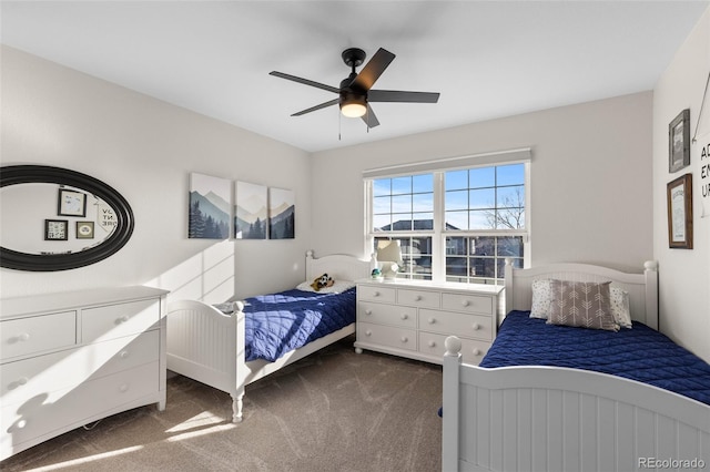 bedroom with a ceiling fan and carpet floors