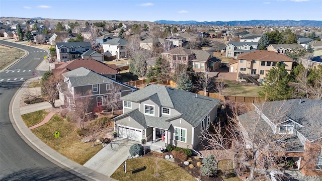 aerial view featuring a mountain view and a residential view