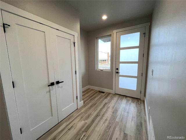 doorway to outside with light hardwood / wood-style floors