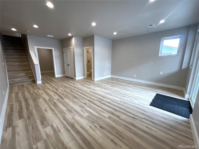 unfurnished living room with light wood-type flooring