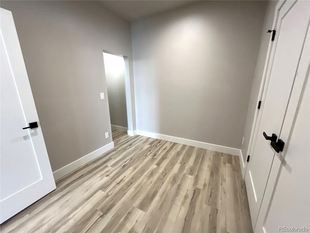 unfurnished bedroom with light wood-type flooring