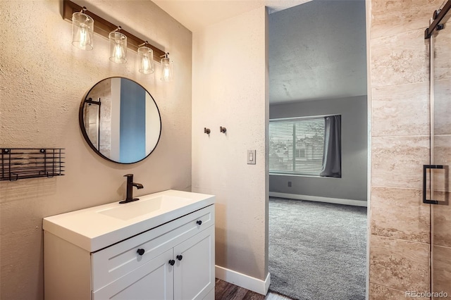 bathroom with vanity and a textured ceiling