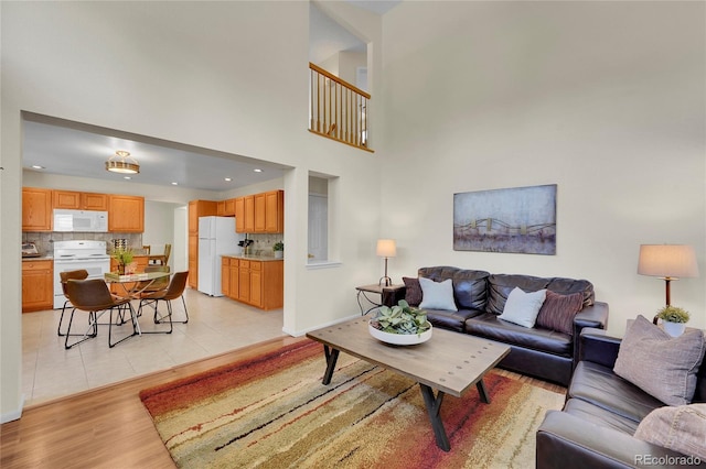 19075 E Grand Cir, Aurora, CO 80015 - living area featuring light wood-style flooring, baseboards, and recessed lighting
