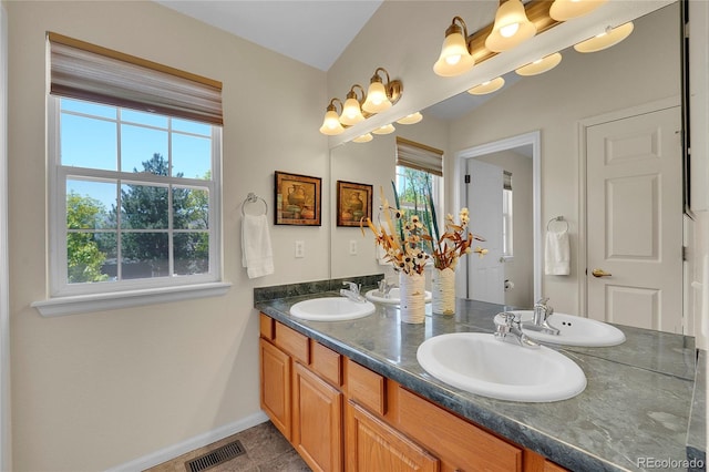 19075 E Grand Cir, Aurora, CO 80015 - bathroom featuring double vanity and baseboards