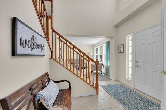19075 E Grand Cir, Aurora, CO 80015 - entryway featuring tile patterned flooring, stairs, and baseboards