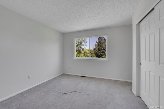 19075 E Grand Cir, Aurora, CO 80015 - unfurnished bedroom with carpet flooring, a textured ceiling, and baseboards