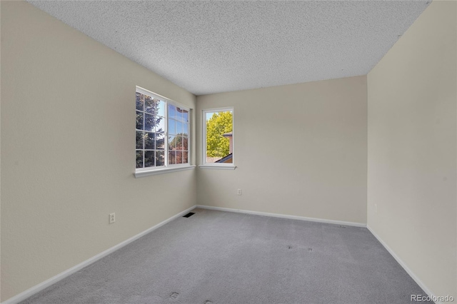19075 E Grand Cir, Aurora, CO 80015 - carpeted spare room with a textured ceiling and baseboards