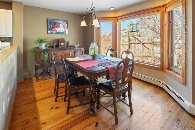 400 W Galena, Moffat, CO 81131 - dining room featuring light wood-style floors and a chandelier
