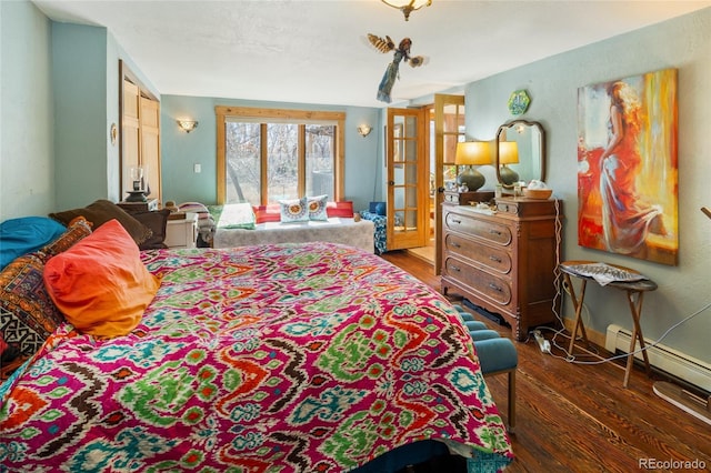 400 W Galena, Moffat, CO 81131 - bedroom with wood finished floors, french doors, and baseboard heating