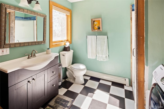 400 W Galena, Moffat, CO 81131 - full bath featuring a baseboard heating unit, tile patterned floors, washer / clothes dryer, and vanity