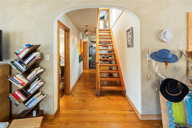 400 W Galena, Moffat, CO 81131 - hall with arched walkways, stairway, and light wood-type flooring