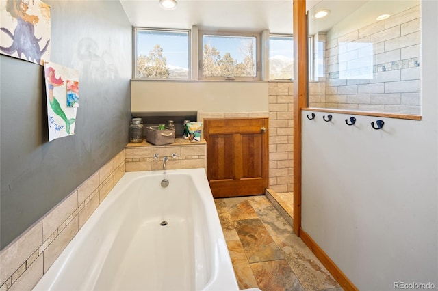 400 W Galena, Moffat, CO 81131 - full bath featuring stone finish flooring, a bath, recessed lighting, and walk in shower