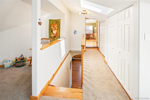 400 W Galena, Moffat, CO 81131 - hallway featuring a skylight, carpet floors, an upstairs landing, and lofted ceiling