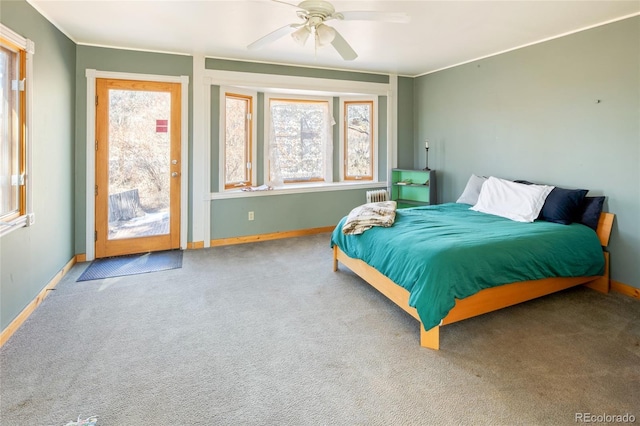 400 W Galena, Moffat, CO 81131 - bedroom featuring radiator heating unit, access to outside, carpet flooring, and a ceiling fan