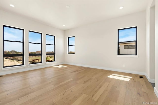 1889 Spring Bloom Dr, Windsor, CO 80550 - empty room with light wood-style floors, baseboards, and recessed lighting