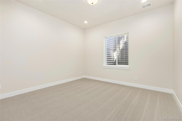 1889 Spring Bloom Dr, Windsor, CO 80550 - spare room featuring baseboards, carpet floors, and recessed lighting