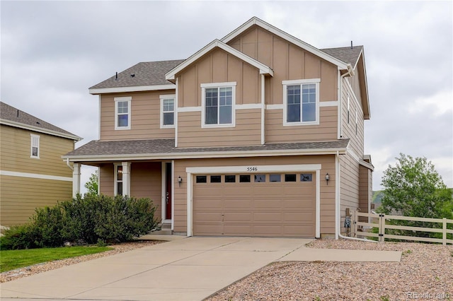 5546 Echo Hollow St, Castle Rock, CO 80104 - view of front of house with concrete driveway, an attached garage, board and batten siding, and a shingled roof