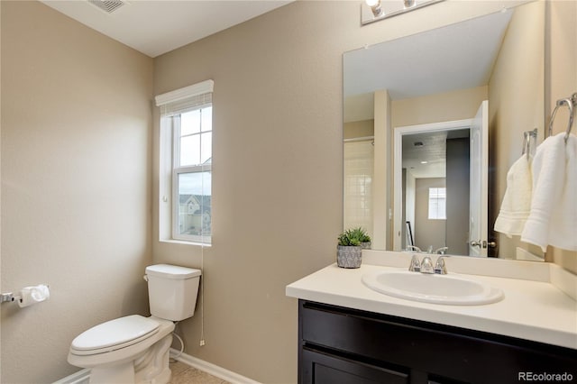 5546 Echo Hollow St, Castle Rock, CO 80104 - full bath featuring toilet, plenty of natural light, vanity, and baseboards