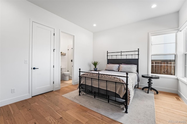 bedroom featuring recessed lighting, visible vents, baseboards, and wood finished floors