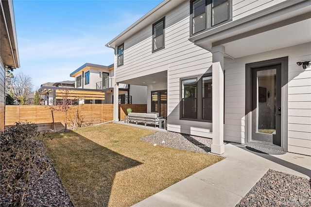 exterior space featuring fence and a patio