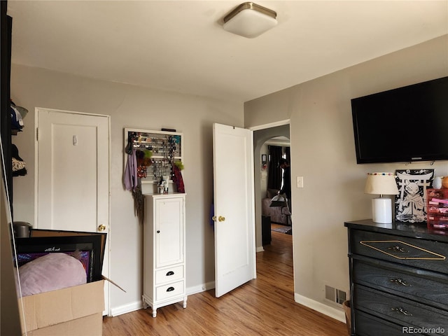 bedroom with light hardwood / wood-style flooring