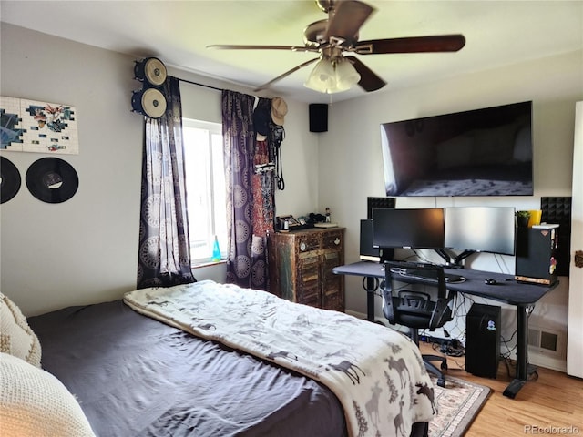 bedroom featuring light wood-type flooring and ceiling fan