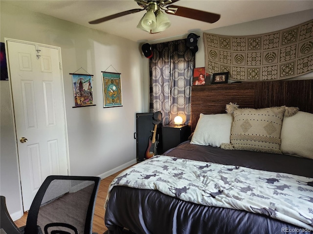 bedroom featuring ceiling fan and wood-type flooring