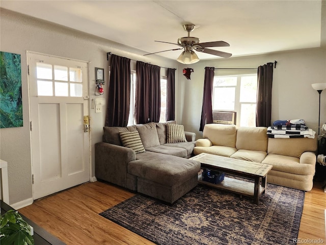 living room with ceiling fan and hardwood / wood-style floors