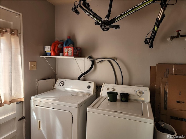 laundry room with washing machine and clothes dryer