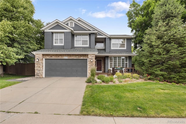 2249 Weatherstone Cir, Highlands Ranch, CO 80126 - view of front facade with an attached garage, concrete driveway, stone siding, and a porch