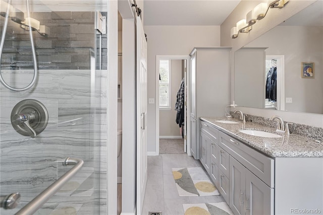 2249 Weatherstone Cir, Highlands Ranch, CO 80126 - bathroom with a shower stall, double vanity, and tile patterned floors