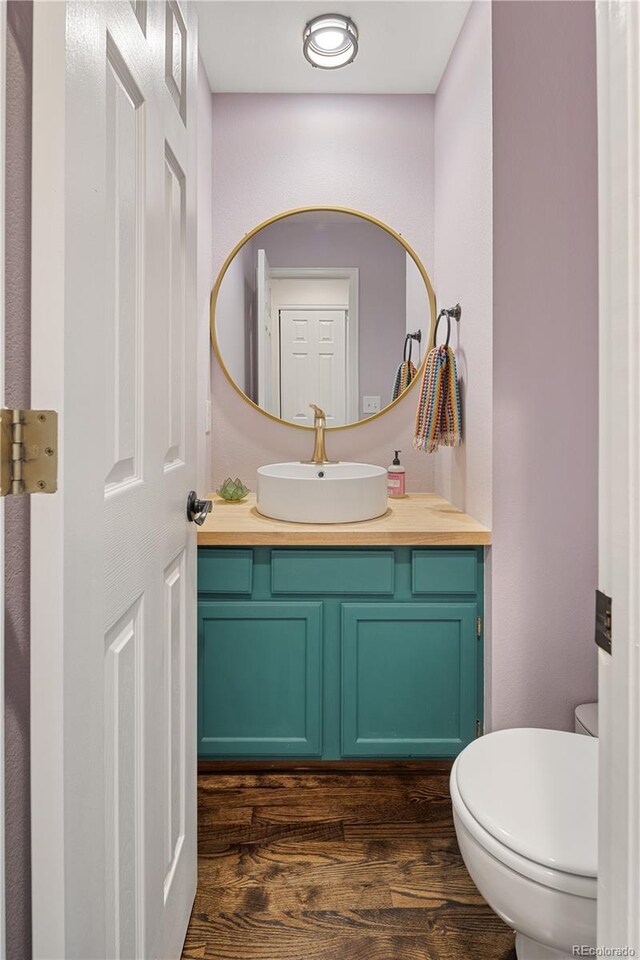 2249 Weatherstone Cir, Highlands Ranch, CO 80126 - half bath with wood finished floors and vanity