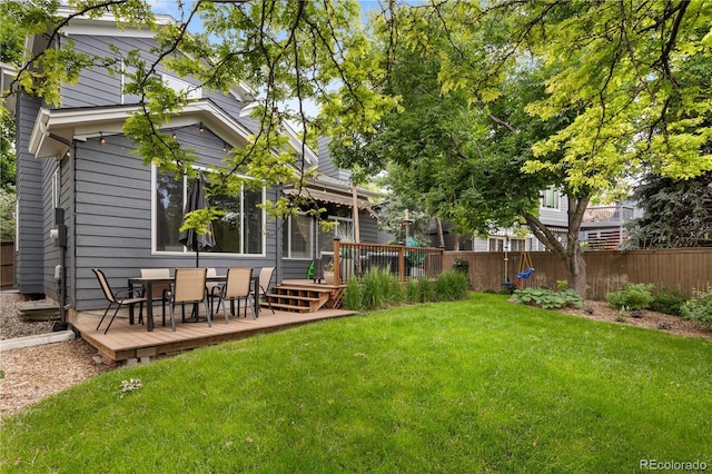 2249 Weatherstone Cir, Highlands Ranch, CO 80126 - view of yard with a wooden deck and outdoor dining space