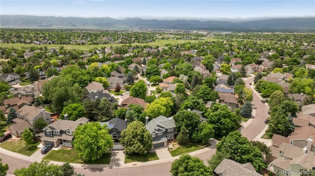 2249 Weatherstone Cir, Highlands Ranch, CO 80126 - aerial perspective of suburban area with a mountain backdrop