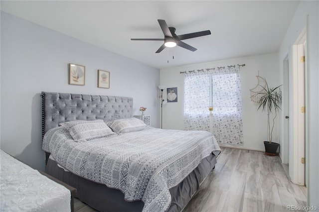 bedroom featuring ceiling fan and wood finished floors