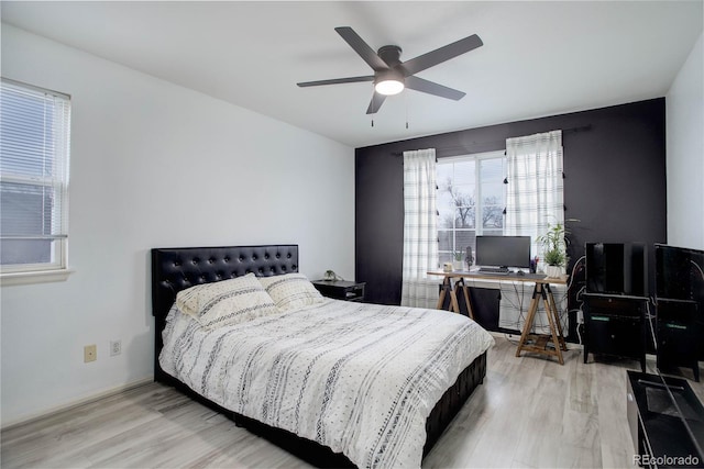 bedroom featuring wood finished floors and ceiling fan